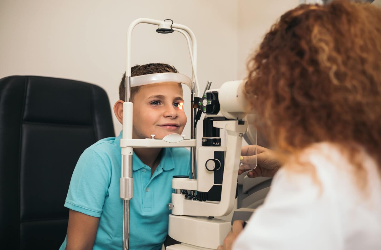 Child having an eye exam with an optometrist